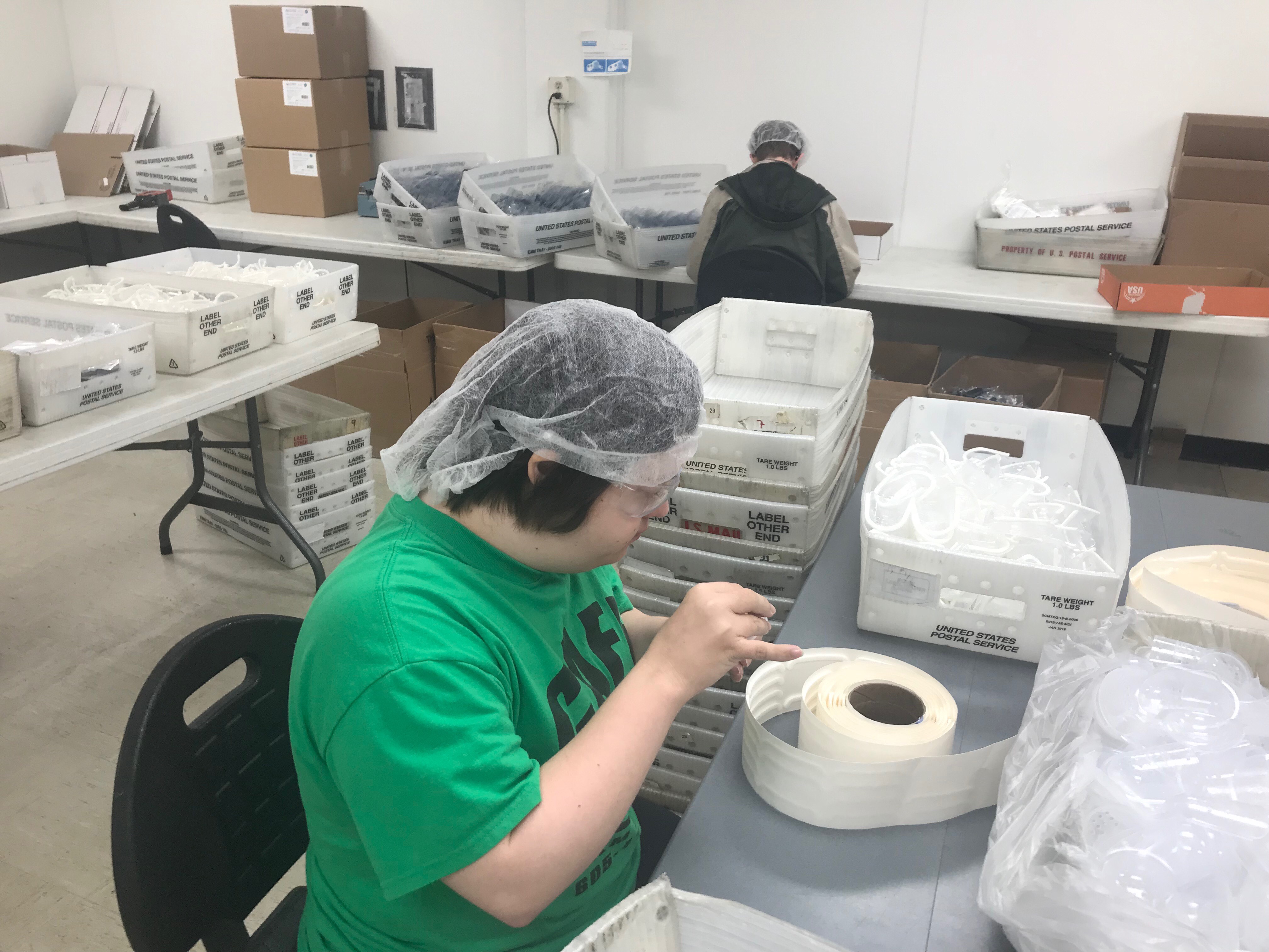 Lafayette Employee assembling product for customers.